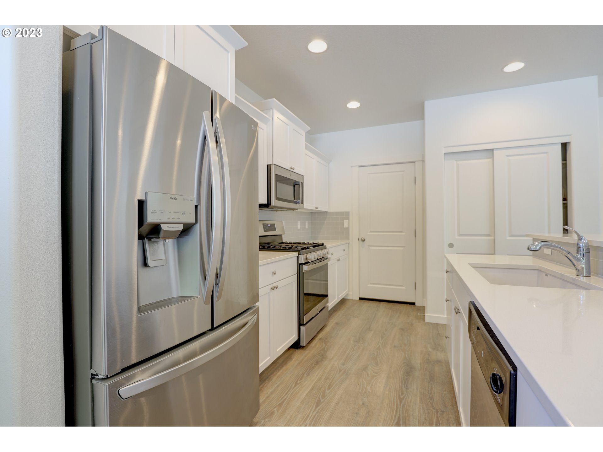 2601 Ericksen Way The Dalles, OR 97058 - Photo 15 of 37 a kitchen with stainless steel appliances a refrigerator and a sink
