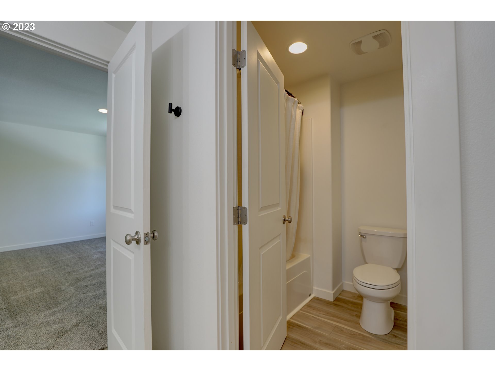 2601 Ericksen Way The Dalles, OR 97058 - Photo 23 of 37 a bathroom with a granite countertop sink a toilet and a shower