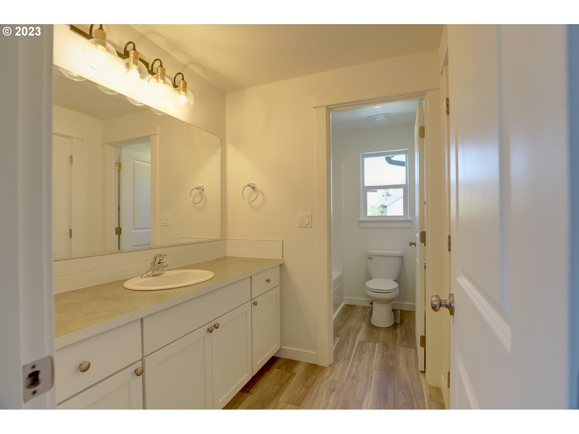 2601 Ericksen Way The Dalles, OR 97058 - Photo 28 of 37 a bathroom with a granite countertop sink mirror and toilet