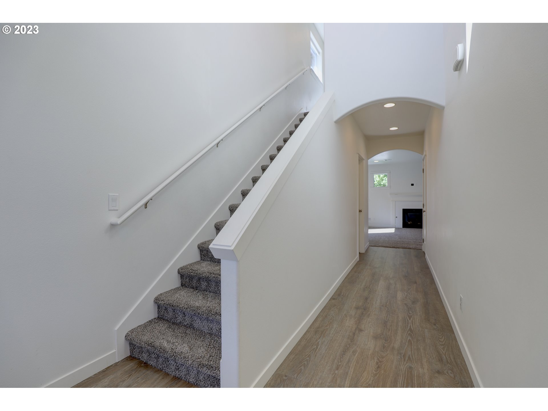 2601 Ericksen Way The Dalles, OR 97058 - Photo 4 of 37 a view of a hallway with wooden floor and staircase