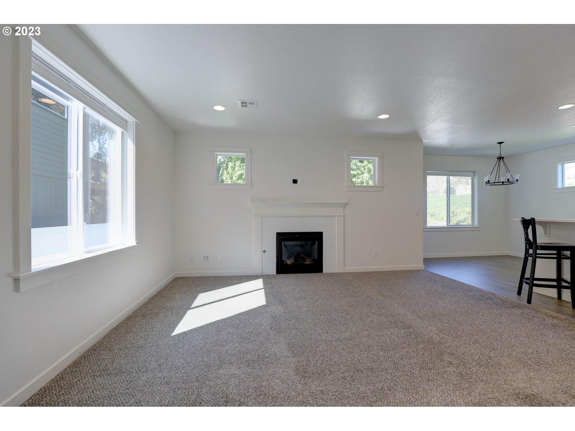 2601 Ericksen Way The Dalles, OR 97058 - Photo 6 of 37 a view of a livingroom with a fireplace and window