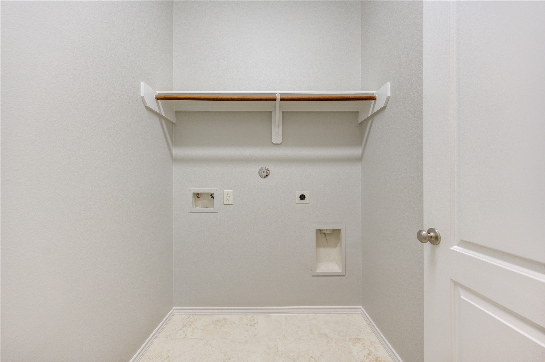 27407 Gatlin Lane Spring, TX 77386 - Photo 30 of 35 A dedicated laundry room with built-in shelving offers added convenience and practical storage, making everyday tasks simple and organized.