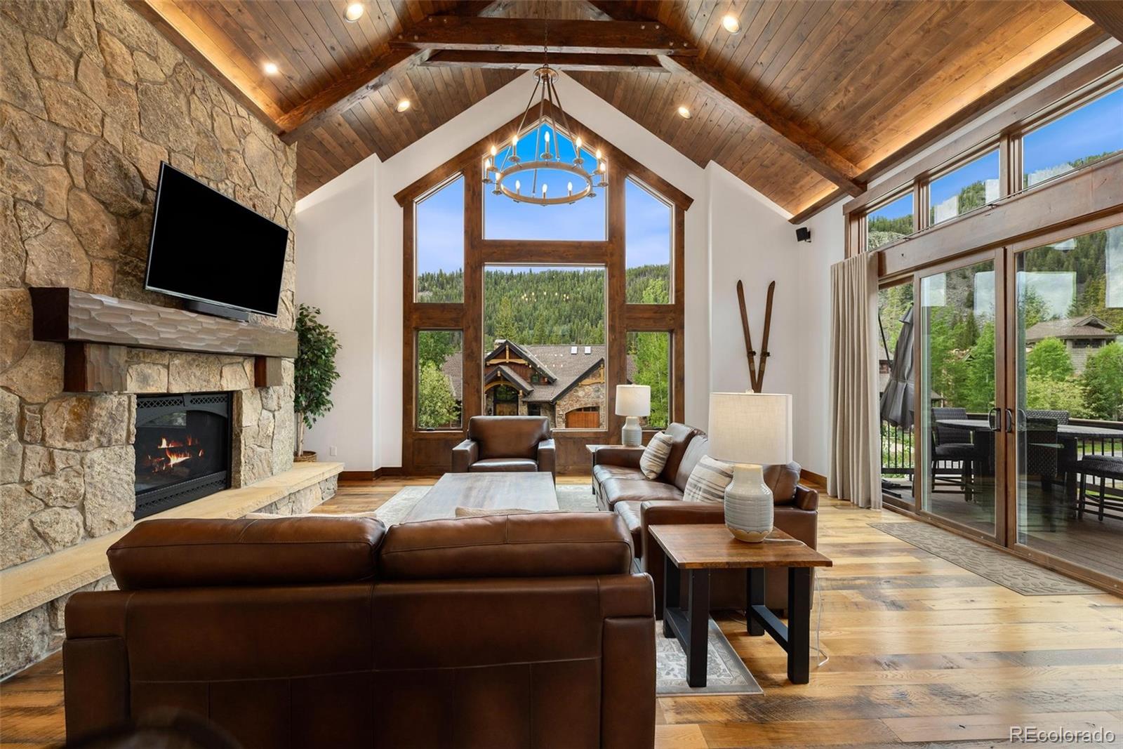 30 Wolf Rock Road Keystone, CO 80435 - Photo 3 of 39 a living room with furniture a fireplace and a flat screen tv