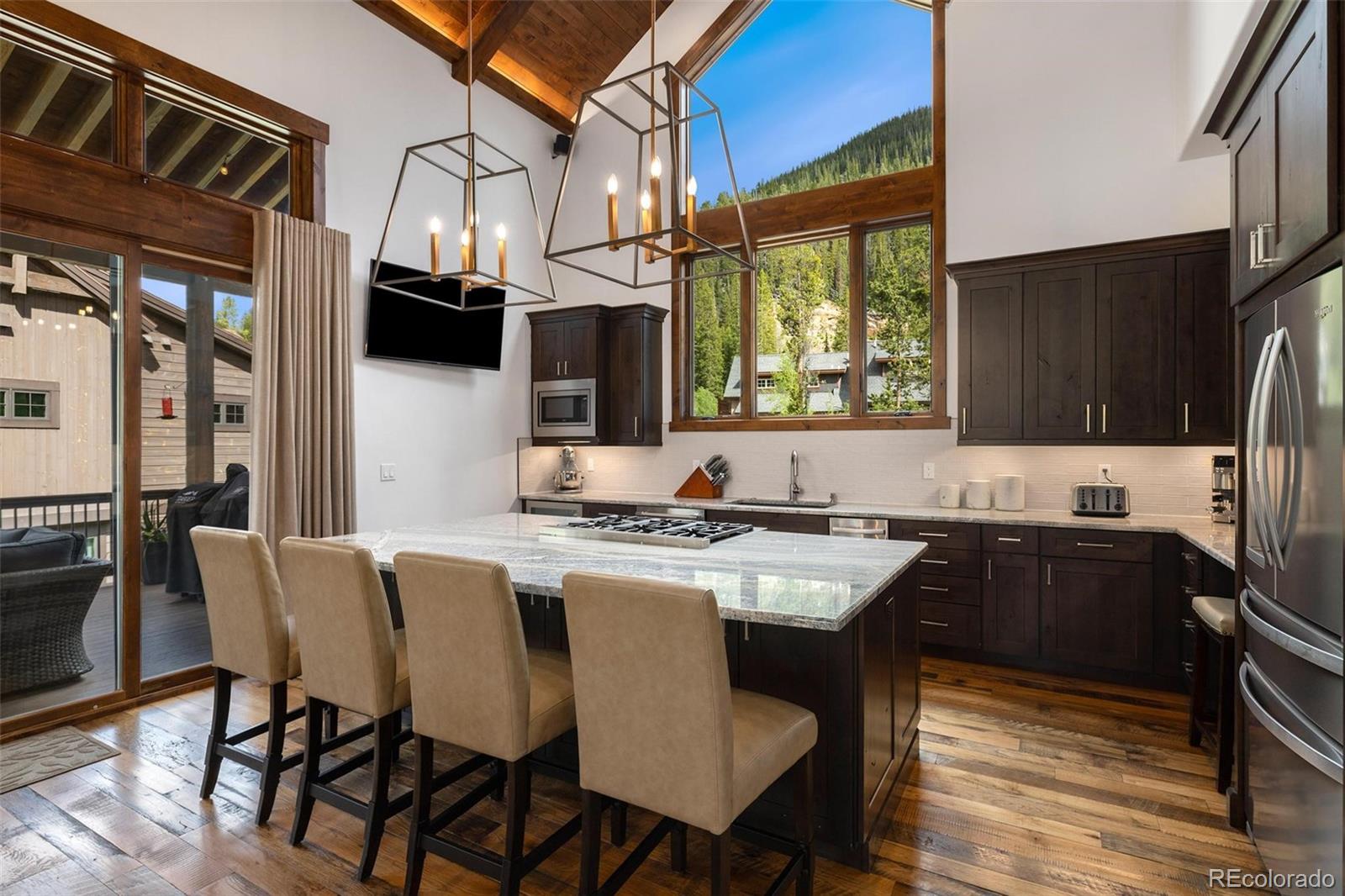 30 Wolf Rock Road Keystone, CO 80435 - Photo 8 of 39 a kitchen with granite countertop a sink appliances and cabinets