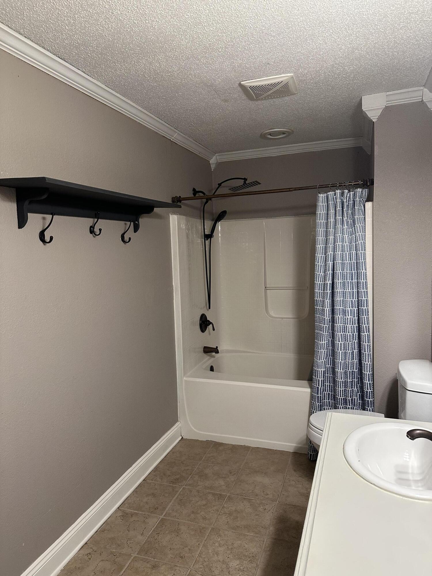 111 Sikes Drive Crestview, FL 32539 - Photo 11 of 20 a bathroom with a bathtub and a shower