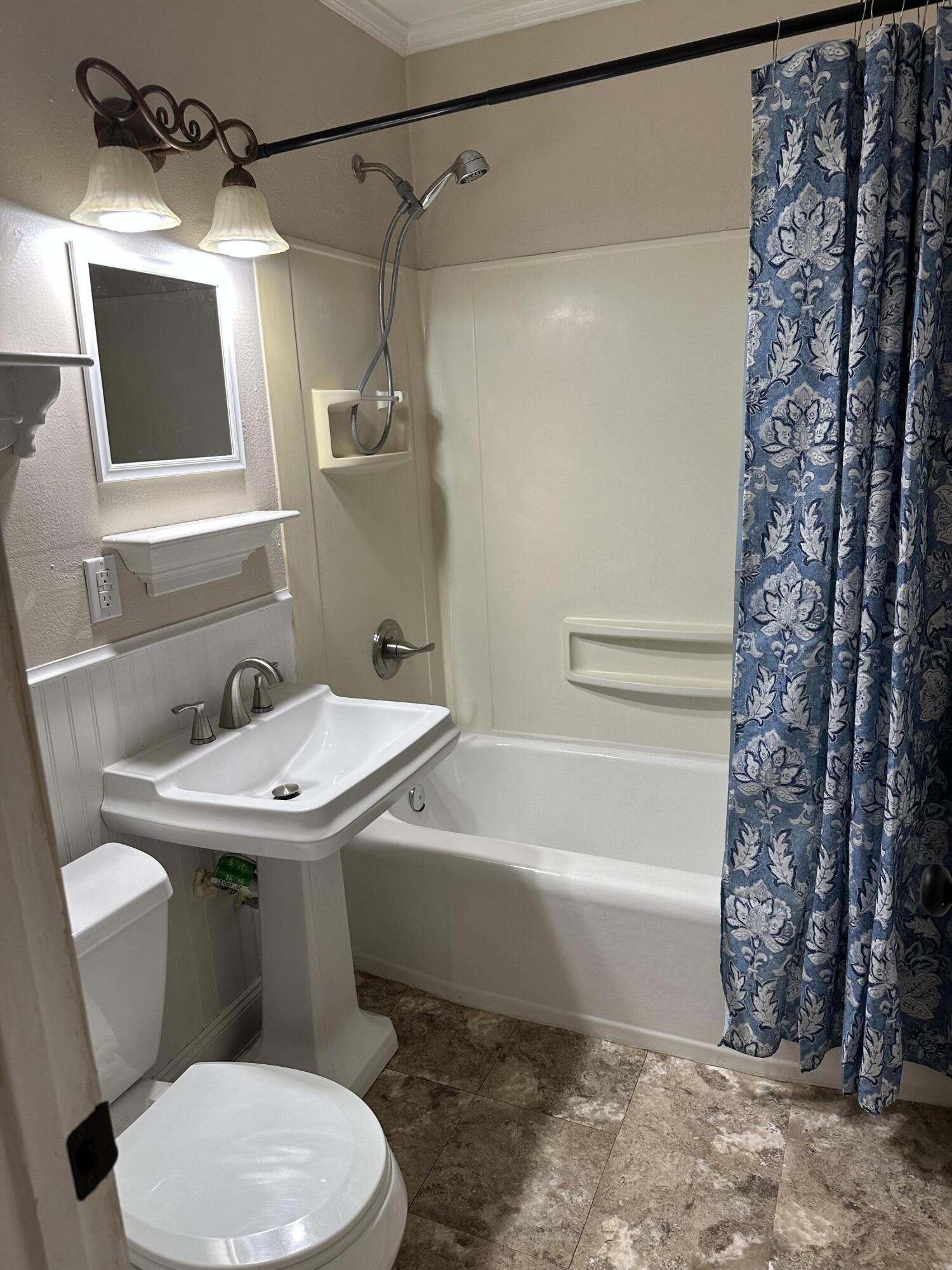 111 Sikes Drive Crestview, FL 32539 - Photo 13 of 20 a bathroom with a sink toilet and shower