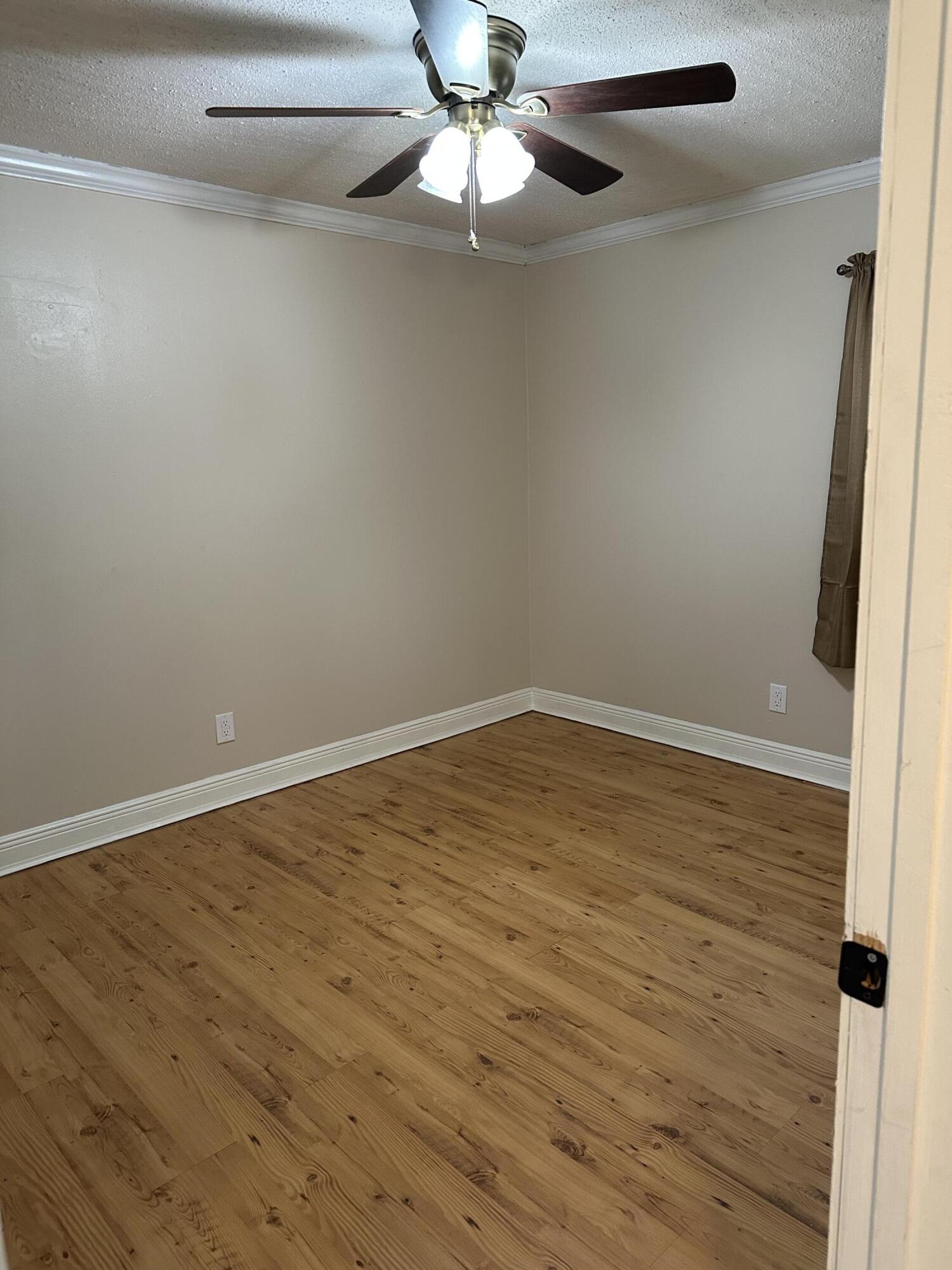 111 Sikes Drive Crestview, FL 32539 - Photo 14 of 20 wooden floor in an empty room