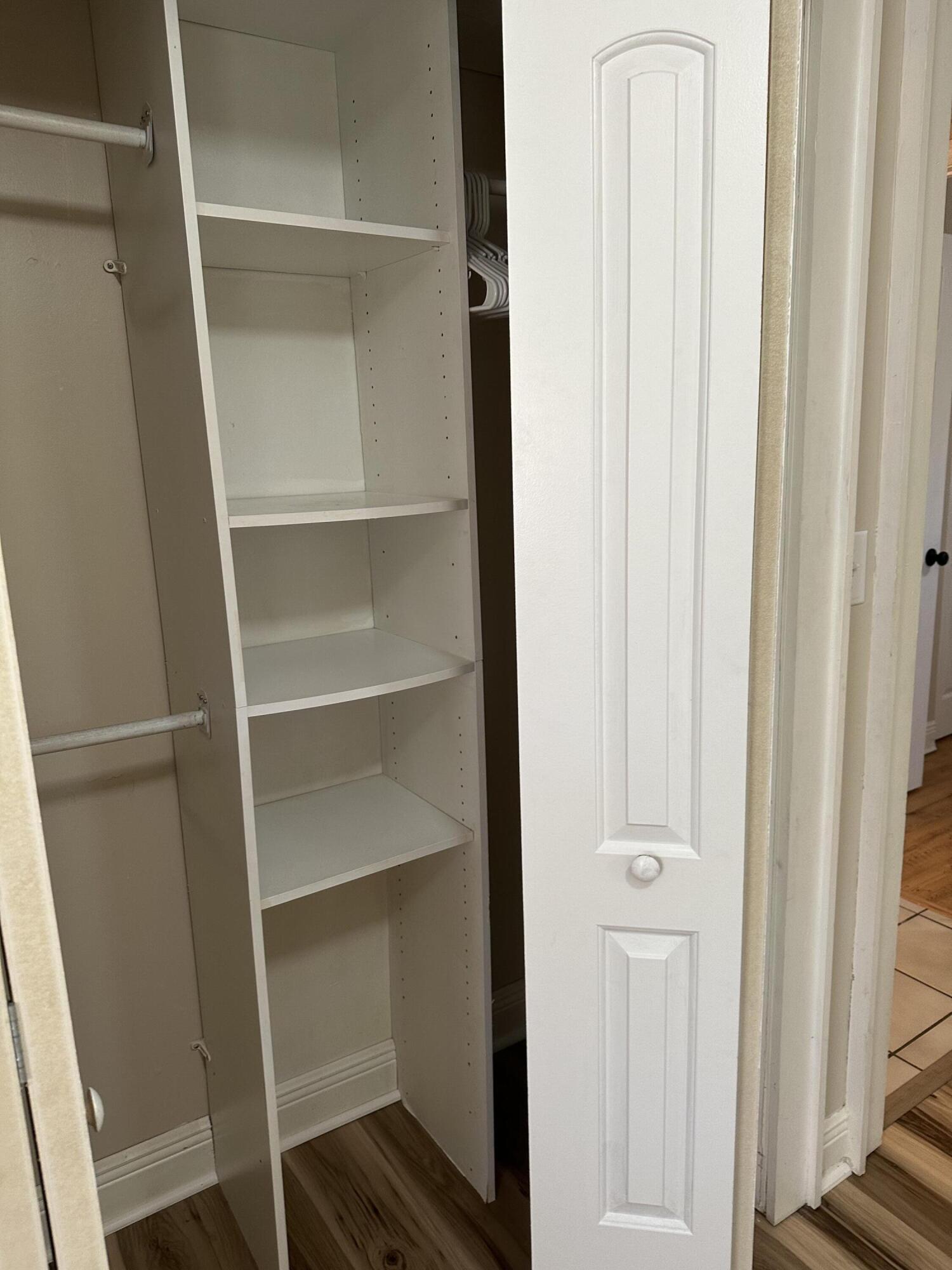 111 Sikes Drive Crestview, FL 32539 - Photo 16 of 20 a view of walk in closet with empty racks