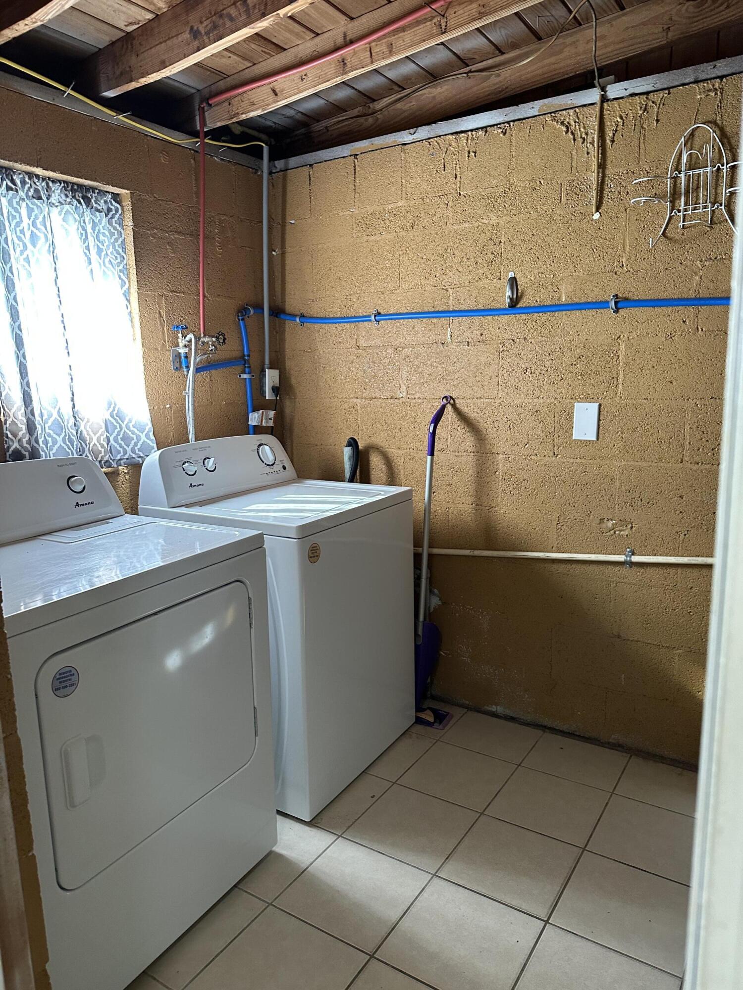 111 Sikes Drive Crestview, FL 32539 - Photo 18 of 20 a utility room with dryer and washer