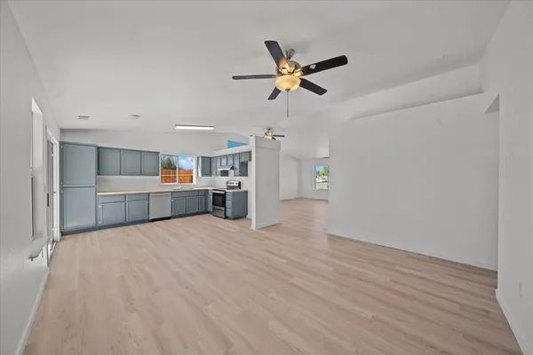 a view of a kitchen with a sink and dishwasher