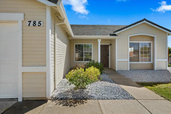 a front view of a house with garden