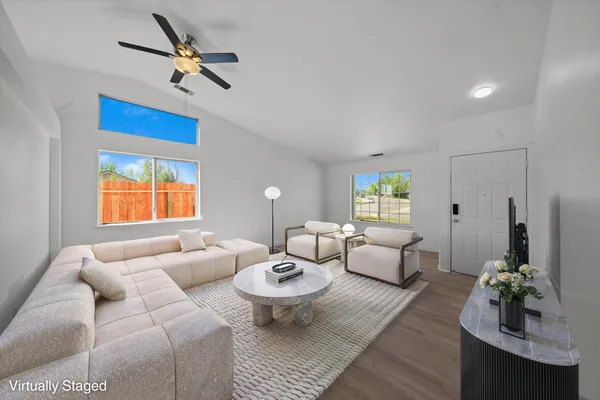 a living room with furniture and a large window