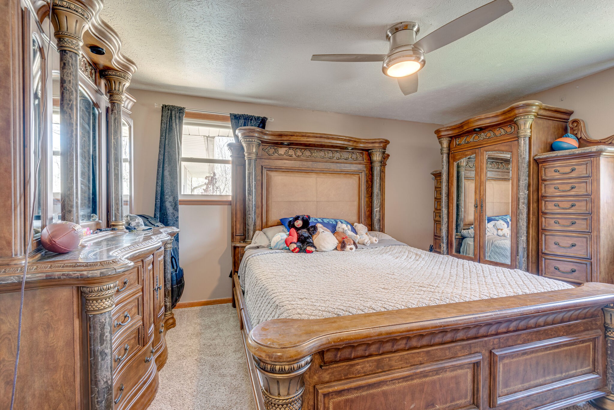 1065 Oak Grove Road Dickson, TN 37055 - Photo 13 of 30 a bedroom with a bed dresser and a window