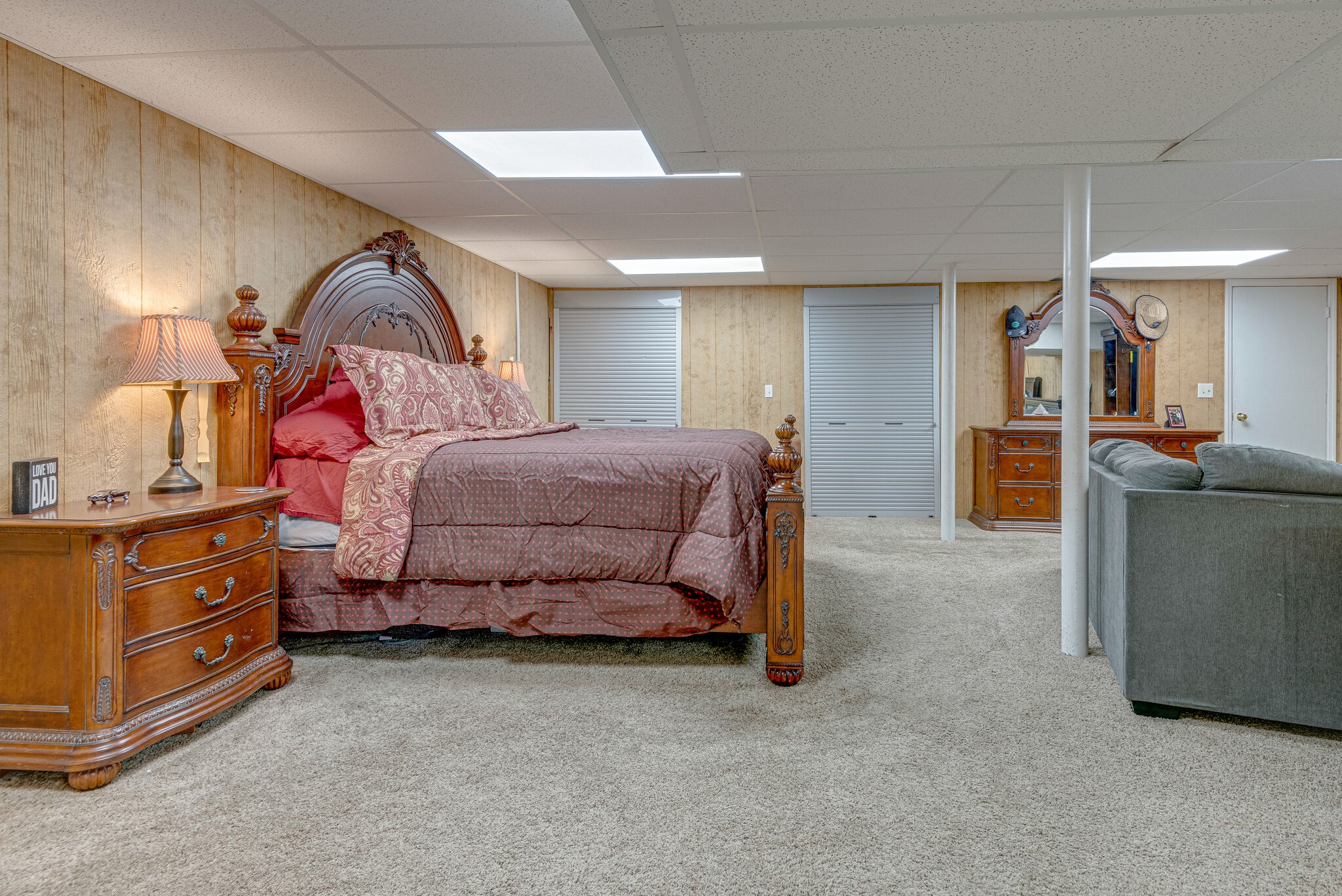 1065 Oak Grove Road Dickson, TN 37055 - Photo 14 of 30 a bedroom with a bed and dresser with mirror