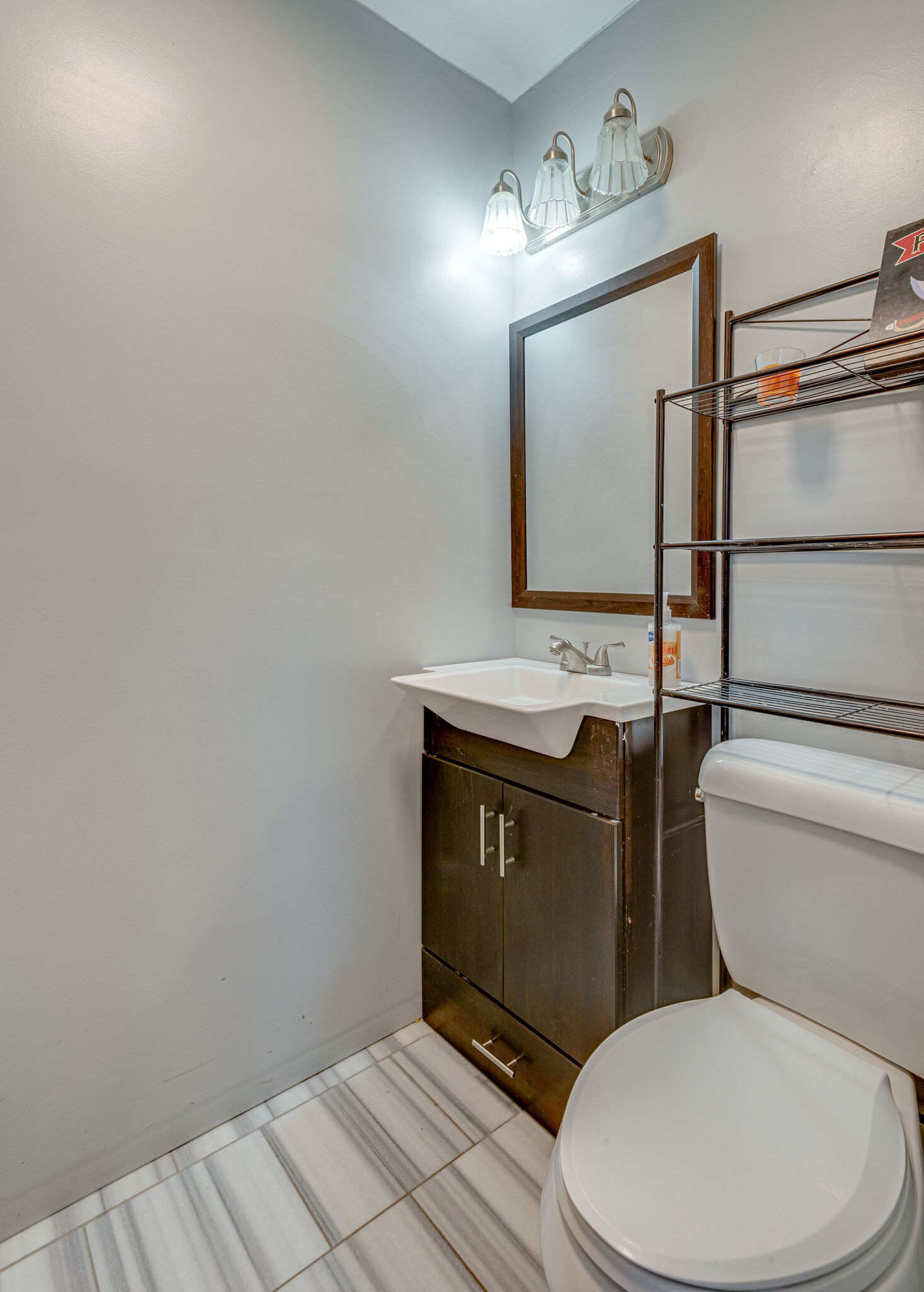 1065 Oak Grove Road Dickson, TN 37055 - Photo 18 of 30 a bathroom with a toilet sink and mirror