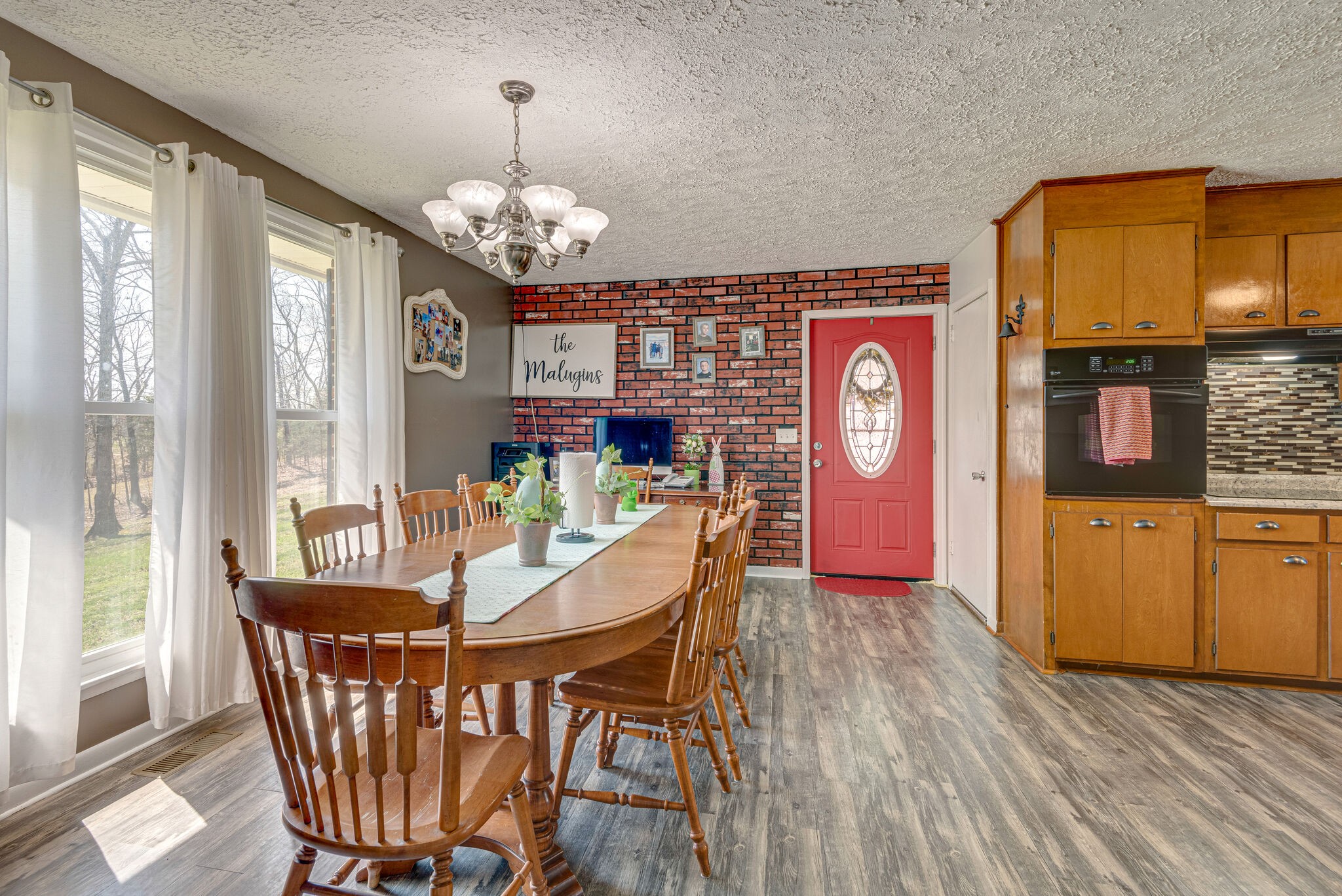 1065 Oak Grove Road Dickson, TN 37055 - Photo 5 of 30 a view of a dining room with furniture window and wooden floor