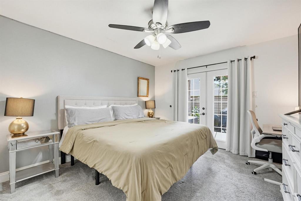 322 West Harwood Road, Unit B Hurst, TX 76054 - Photo 14 of 34 Primary bedroom is downstairs with doors to patio