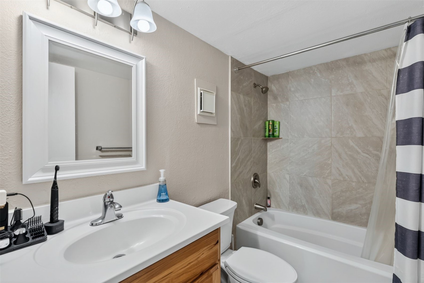 8100 Ryan Gulch Road, Unit 106 Wildernest, CO 80498 - Photo 16 of 43 a bathroom with a bathtub shower sink vanity and toilet
