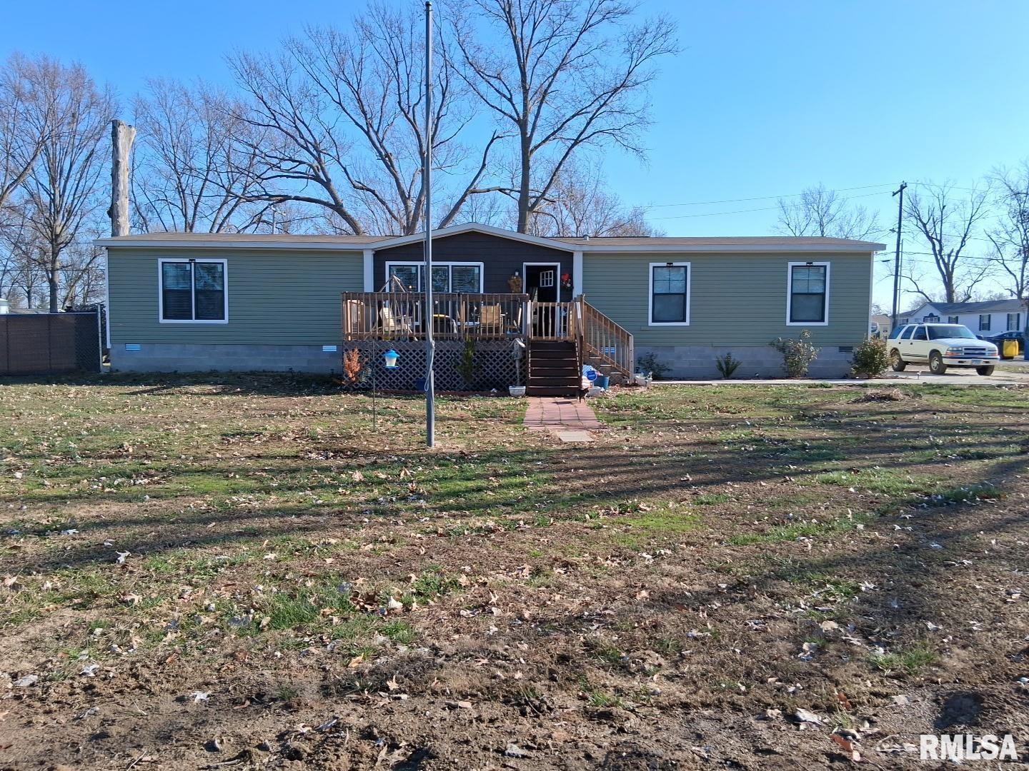 1300 Jackson Avenue Sandoval, IL 62882 - Photo 1 of 16 a view of a house with a yard