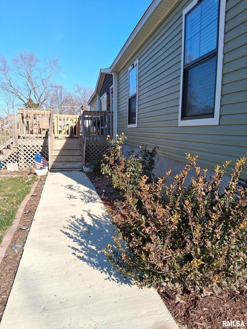 1300 Jackson Avenue Sandoval, IL 62882 - Photo 2 of 16 a front view of a house with a yard