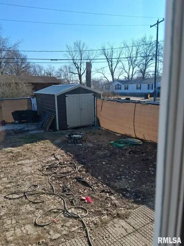 a view of a backyard of the house