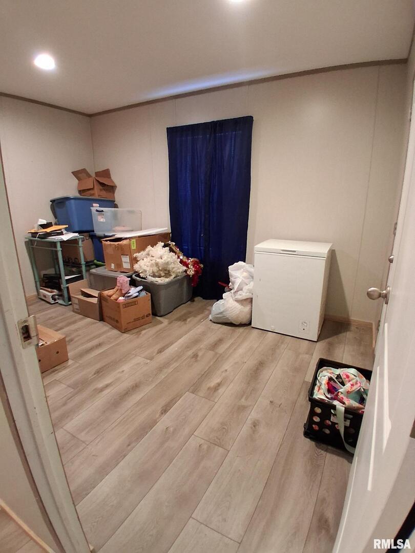 1300 Jackson Avenue Sandoval, IL 62882 - Photo 9 of 16 a bedroom with a bed and a couch