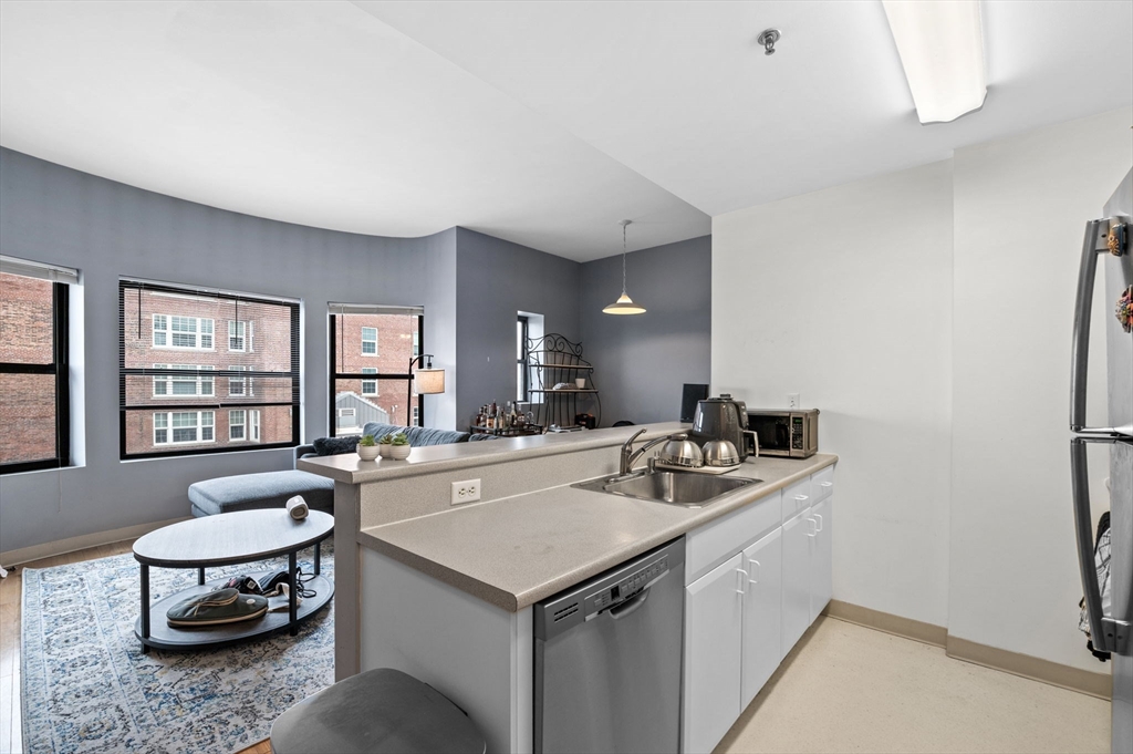 636 Beacon Street, Unit 605 Boston, MA 02215 - Photo 1 of 23 a kitchen with a stove a sink and a refrigerator