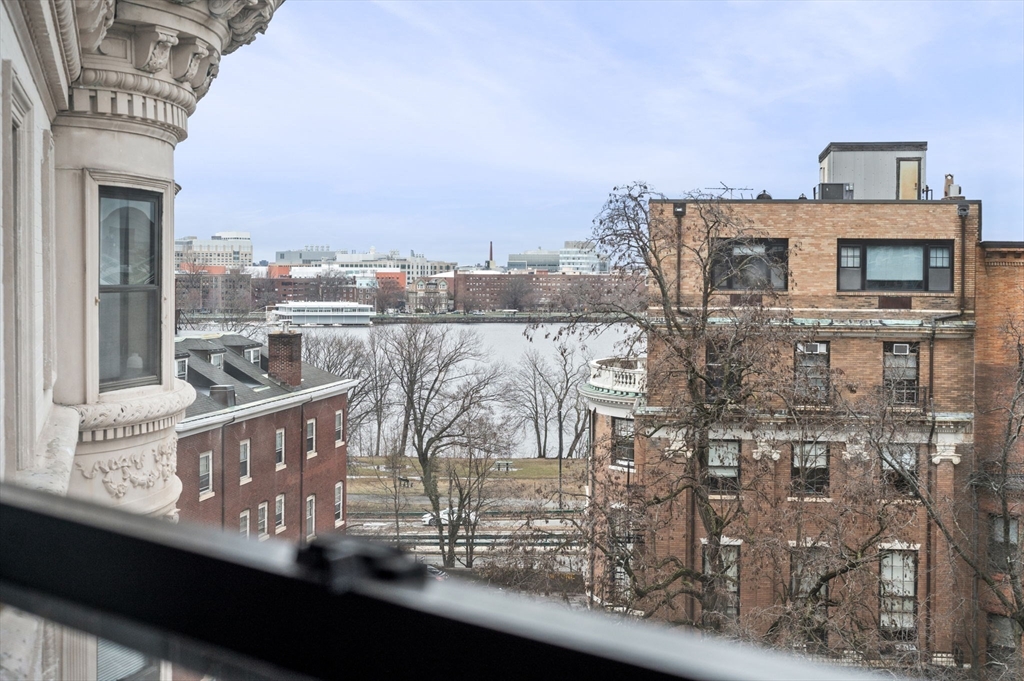 636 Beacon Street, Unit 605 Boston, MA 02215 - Photo 2 of 23 a view of roof deck with two chair and a fireplace