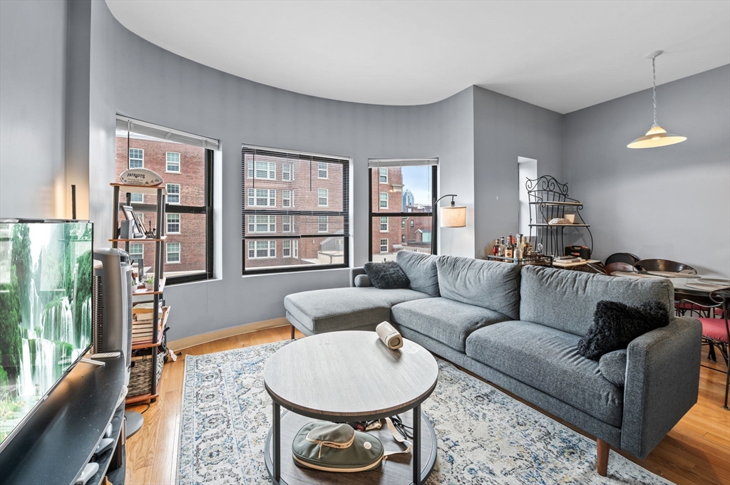 636 Beacon Street, Unit 605 Boston, MA 02215 - Photo 4 of 23 a living room with furniture and a large window