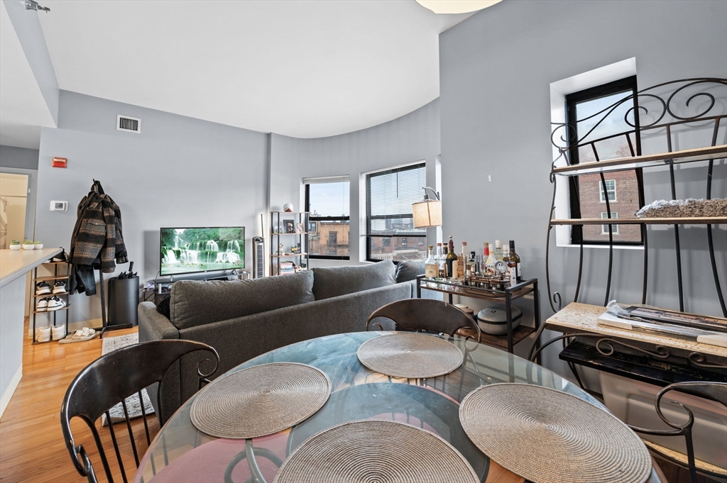 636 Beacon Street, Unit 605 Boston, MA 02215 - Photo 8 of 23 a living room with furniture fireplace and a window
