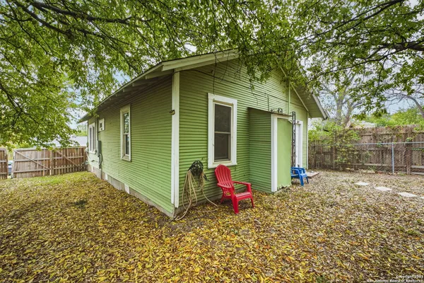 a backyard of a house with seating space
