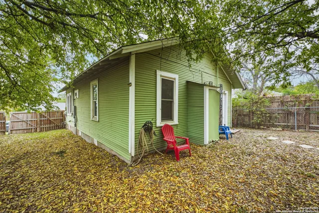 a backyard of a house with seating space