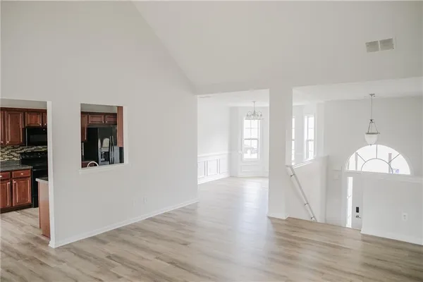 a view of a room with wooden floor