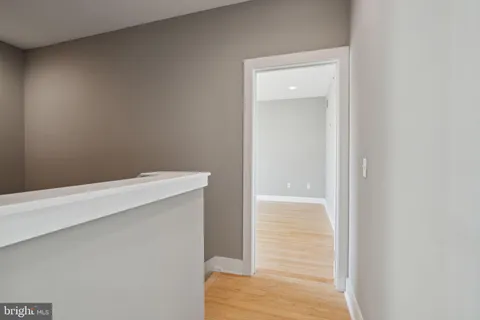 a bathroom with a sink vanity and a mirror