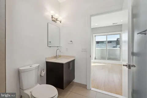 a view of an empty room with windows