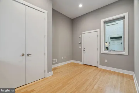 a kitchen with stainless steel appliances a refrigerator and a stove top oven