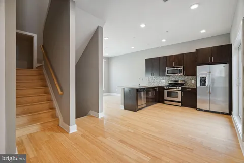a kitchen with sink and window