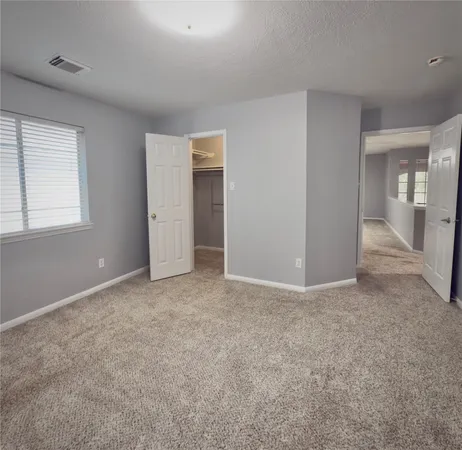 an empty room with a bathroom