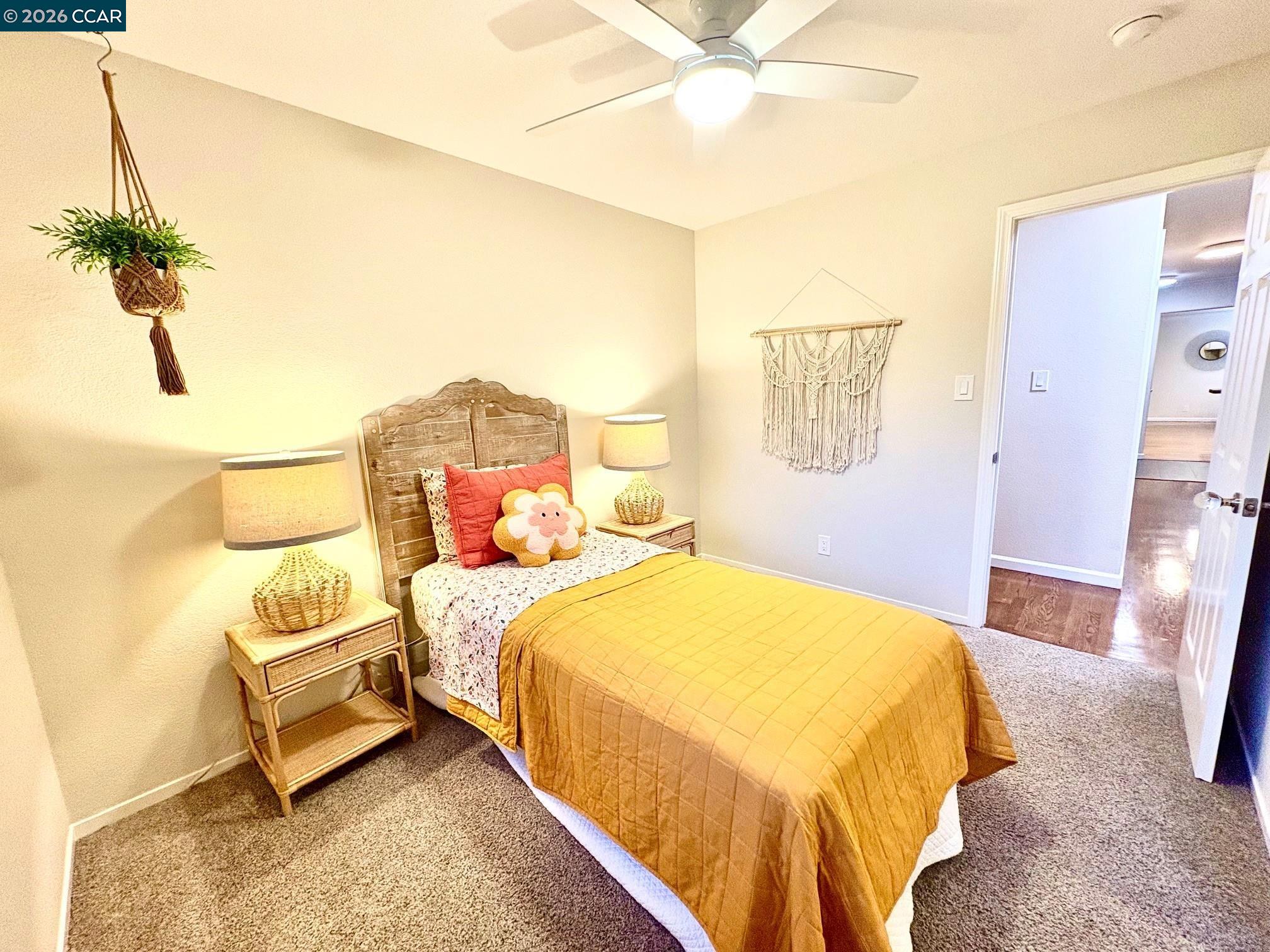 2589 Pebble Beach Loop Lafayette, CA 94549 - Photo 21 of 32 a bedroom with a bed and wooden floor