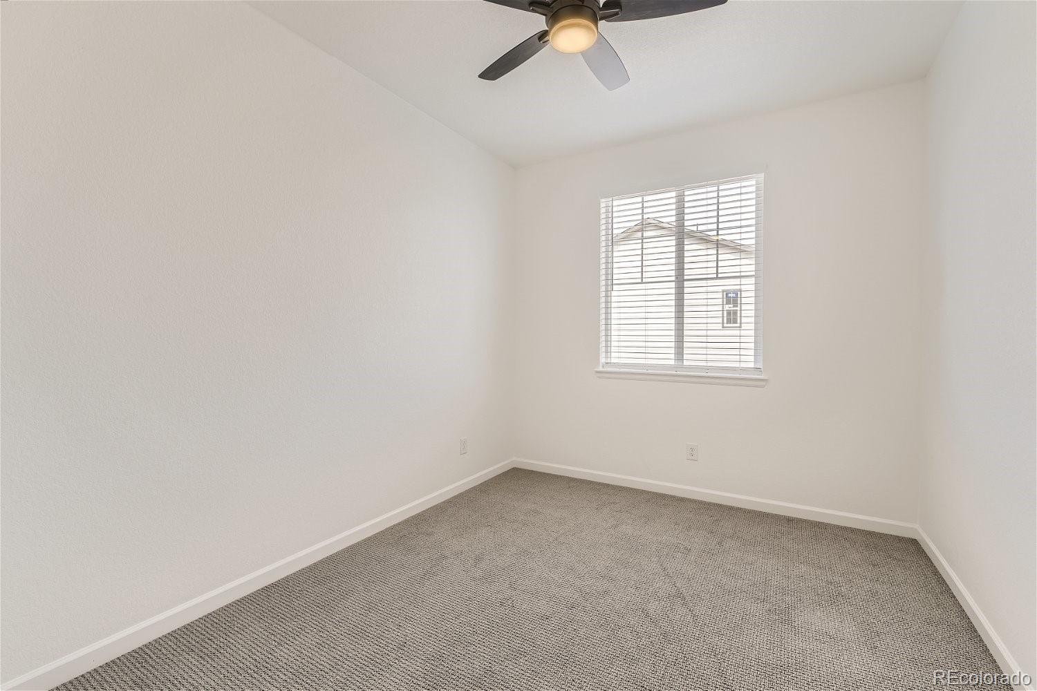12659 Boggs Street Parker, CO 80134 - Photo 18 of 28 an empty room with a window