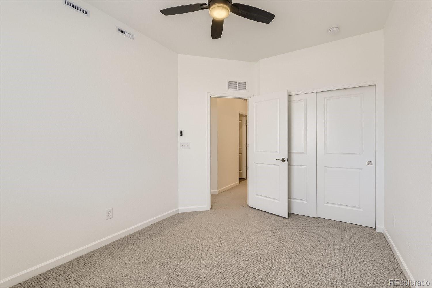 12659 Boggs Street Parker, CO 80134 - Photo 19 of 28 an empty room with fan
