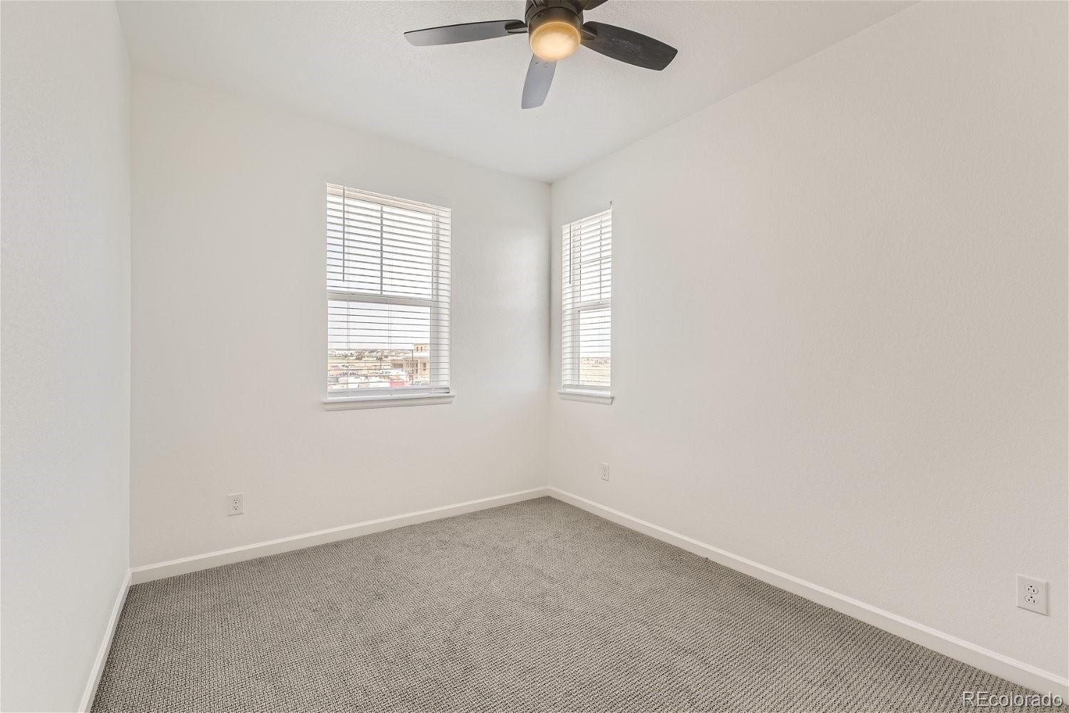 12659 Boggs Street Parker, CO 80134 - Photo 20 of 28 an empty room with a window