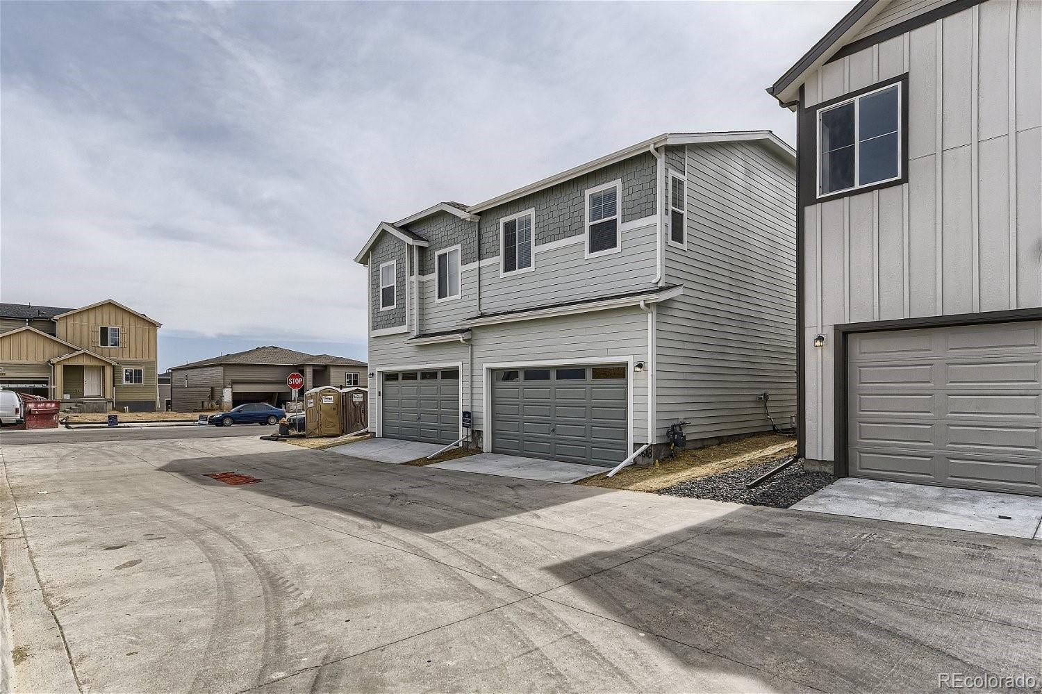 12659 Boggs Street Parker, CO 80134 - Photo 28 of 28 a front view of a house with a yard and garage