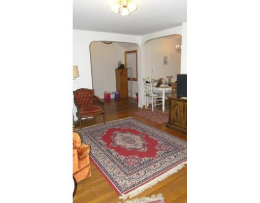 2 Melvin Road Natick, MA 01760 - Photo 5 of 8 a living room with furniture and a rug