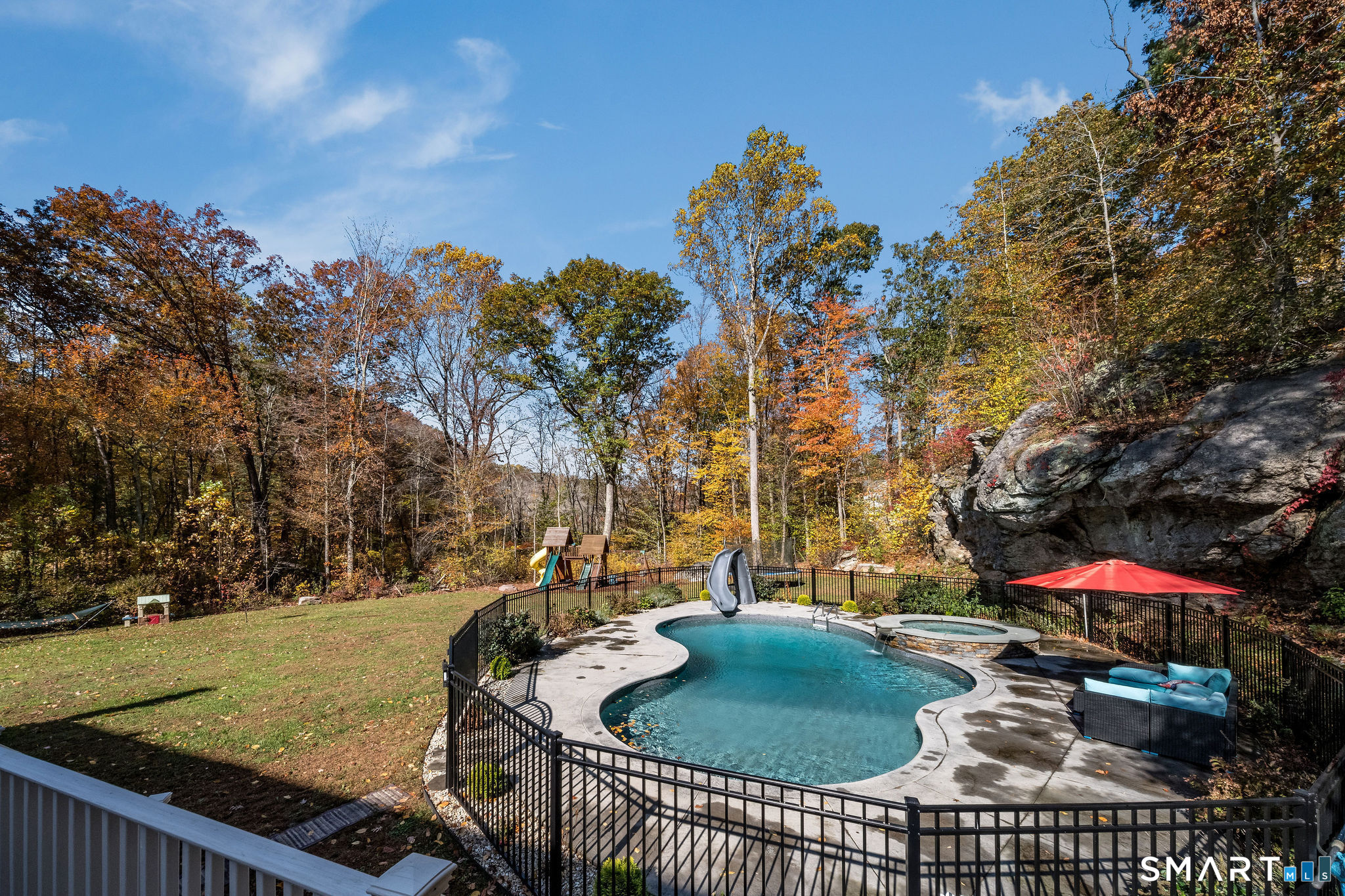 131 Opening Hill Road Madison, CT 06443 - Photo 35 of 40 STUNNING backyard with GORGEOUS pool, and rock wall.