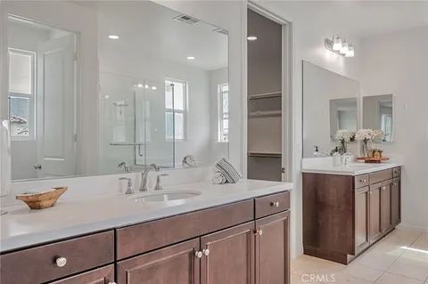 a bathroom with a shower a toilet and a shower