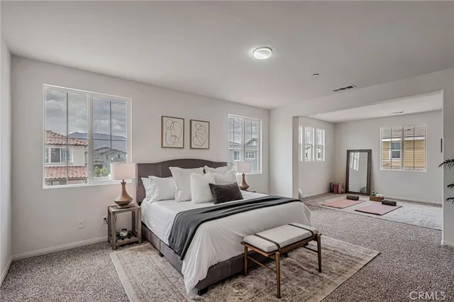 a bedroom with a bed and window