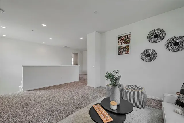 a living room with furniture and a mirror