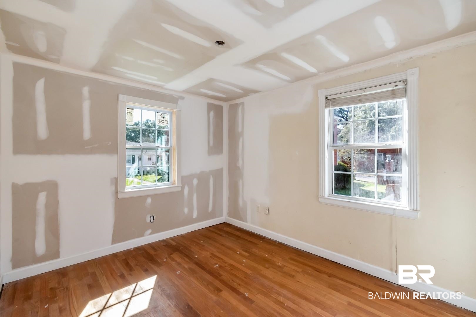214 Upham Street, Unit 4A Mobile, AL 36607 - Photo 20 of 23 Unfurnished room featuring wood finished floors and baseboards