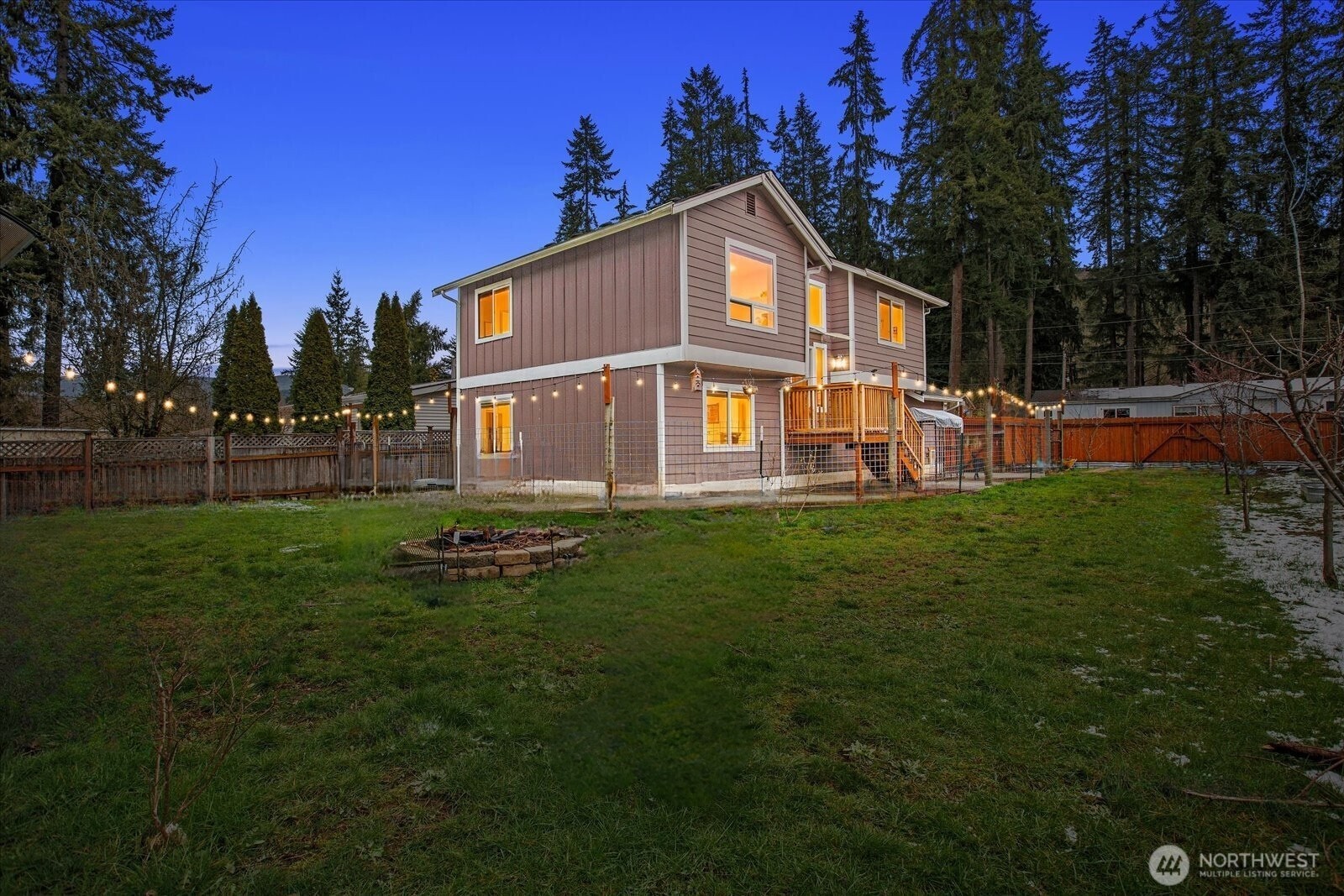 12808 East Macs Loop Road Granite Falls, WA 98252 - Photo 1 of 23 a yellow and red house with a garden